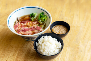rice and meat with sauce is asian food on wood table restaurant