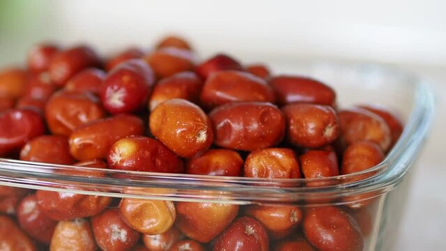large amount of ripe oleaster fruits, oleaster fruits in a glass bowl,
