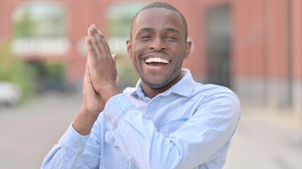 Portrait of Appreciative Young African Man Clapping 