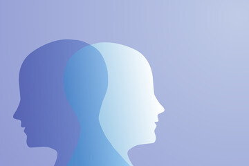 A metaphor for mental bipolar disorder. Two-faced. Split personality. The concept of mood disorder. The concept of dual personality. 2 The silhouette of the head on a blue gradient background. Mental 