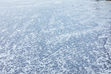 Frozen lake surface and snow