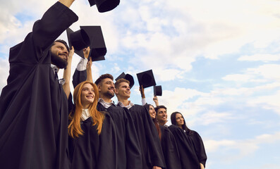 Graduates say goodbye to their university life. Bottom view of a group of university graduates...