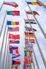 Flags of different countries on flagpoles