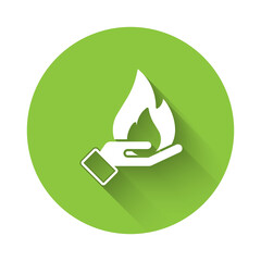 White Hand holding a fire icon isolated with long shadow. Insurance concept. Security, safety, protection, protect concept. Green circle button. Vector