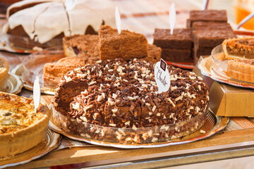 Chocolate cake, displayed pastry at farmers street food market