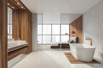 Modern Bathroom bedroom interior in new luxury home. Stylish hotel room. Open space area. Wooden walls concrete floor. Bathtub and double sink.