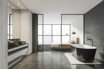 Fototapeta na wymiar Modern Bathroom bedroom interior in new luxury home. Stylish hotel room. Open space area. Wooden walls concrete floor. Bathtub and double sink.
