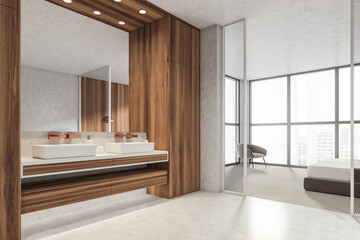 Modern Bathroom bedroom interior in new luxury home. Stylish hotel room. Open space area. Wooden walls concrete floor. Double sink.