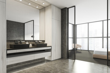 Modern Bathroom bedroom interior in new luxury home. Stylish hotel room. Open space area. Wooden walls concrete floor. Double sink.