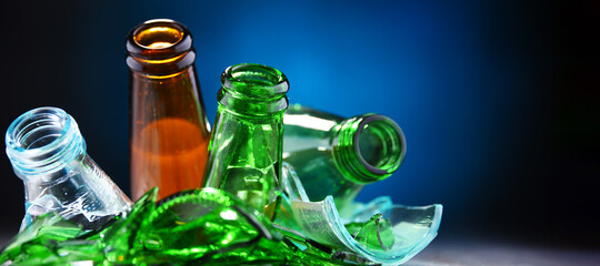 Broken glass bottles and pieces of glass. Recycling.