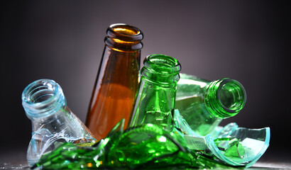 Broken glass bottles and pieces of glass. Recycling.