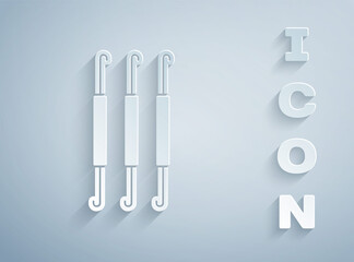 Paper cut Crochet hook icon isolated on grey background. Knitting hook. Paper art style. Vector