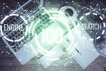 Blockchain theme hologram drawings over computer on the desktop background. Top view. Double exposure.