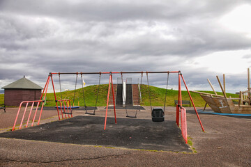 Fototapeta premium Empty playground with swing