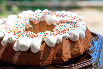 A cupcake with a thick layer of icing like an Easter cake