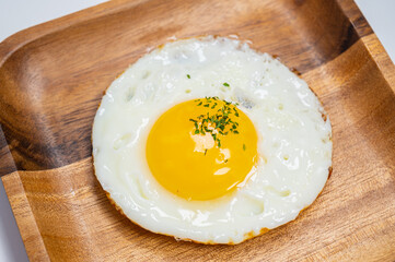 sprinkled with parsley powder fried egg with white background