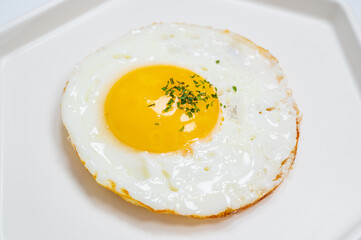 sprinkled with parsley powder fried egg with white background