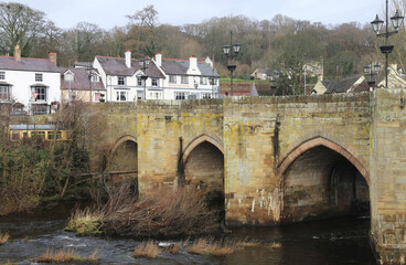 The historical arched bridge across the River Dee in Llangollen, Denbighshire, Wales, UK.