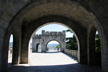 Porch with shade and in the background a part of the wall of Pamplona with sun