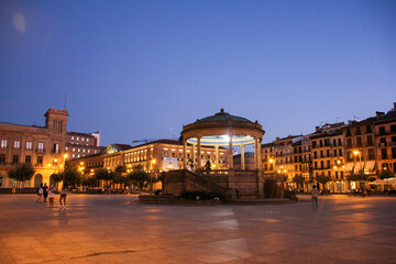 Pamplona Castle Square at night with the famous roundabout in the middle