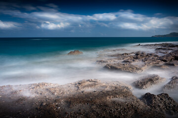 seaside long exposure with a deep blue