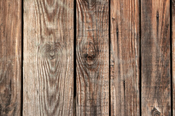 Brown wooden background close-up of old planks and brown timber in vintage style and grunge look as rustic rough and antique organic surface for decoration of backgrounds or as natural frame design