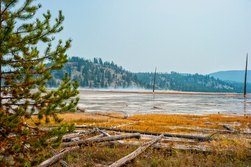 Distant side view of Grand Prismatic Spring on the Fairy Falls trail