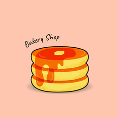 Pancakes on top butter with sweet maple syrup