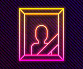 Glowing neon line Mourning photo frame with black ribbon icon isolated on black background. Funeral ceremony and condolence card layout. Vector