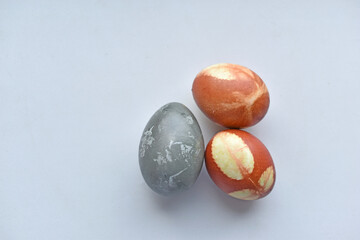 Red and blue Easter eggs on a white background