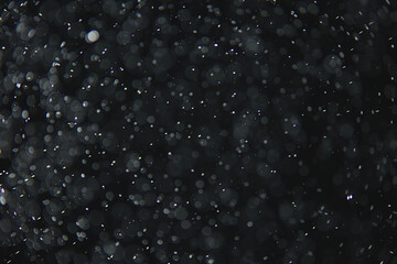 abstract background overlay white bokeh falling snow fog view on black