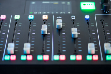 Professional podcast mixing console with faders and adjusting buttons, Audio sound mixer console. Sound mixing desk. Music mixer control panel in recording studio. podca mixer control  broadcasting