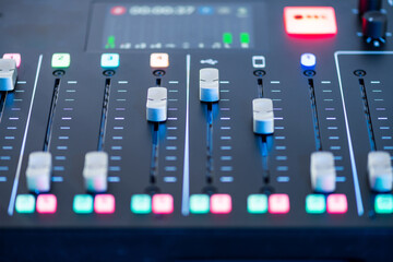 Professional podcast mixing console with faders and adjusting buttons, Audio sound mixer console. Sound mixing desk. Music mixer control panel in recording studio. podca mixer control  broadcasting - obrazy, fototapety, plakaty