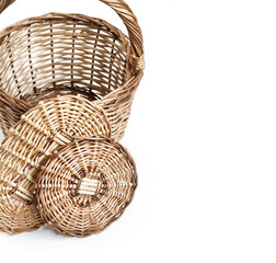 Obraz premium Wicker basket and bottoms for baskets isolated on white background