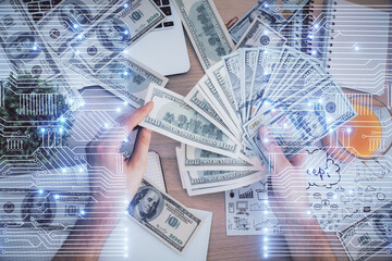 Multi exposure of Tech drawing hologram and USA dollars bills and man hands. Technology concept.