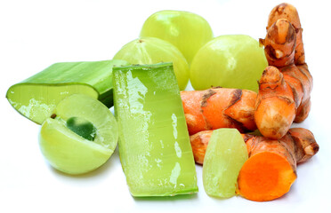 Medicinal aloe Vera, amla and turmeric on white background
