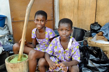 African Siblings Prepare Food - obrazy, fototapety, plakaty
