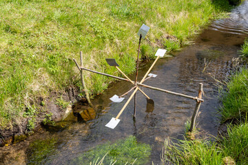 Small water wheel, made by children on a small river flowing through a village.