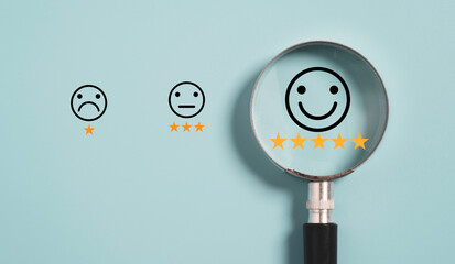 Smiley icon with five star inside magnifier glass on blue background ,