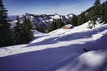 Wonderful wooden hut in snow covered mountains