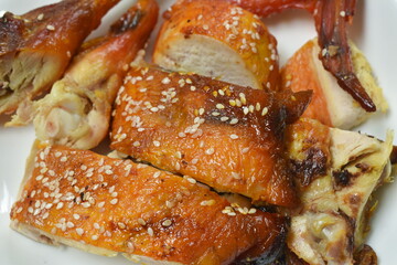 grilled chicken with sauce and sesame on plate dipping spicy sauce