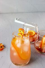 Soft drink made of soda, ice cubes and orange slices