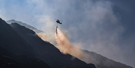   Irish Air Corp Helicopter dumps water to extinguish fire in Killarney National park