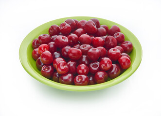 Sweet fresh cherry on color plate isolated on white background