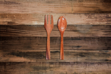 fork and spoon wood on wooden background