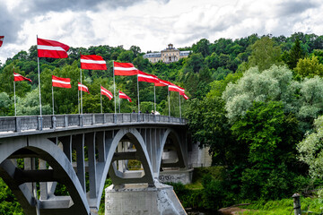 The bridge over Gauja river in Sigulda decorated with national flags in honour of 4th May National...