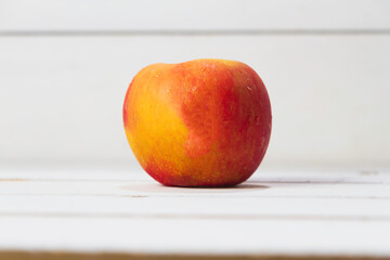 Apple put on wooden timber board,