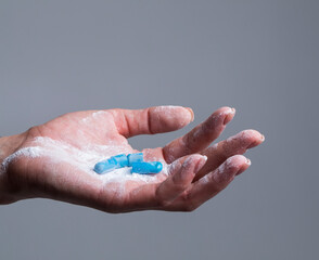 Beautiful female hand holds pill gesture. Virus. Capsule. Pills. 