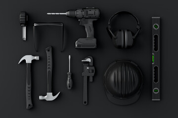 Top view of monochrome construction tools for repair and installation on black