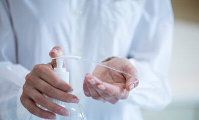 women washing hands with alcohol gel or antibacterial soap sanitizer after using a public restroom.Hygiene concept. prevent the spread of germs and bacteria and avoid infections corona virus
